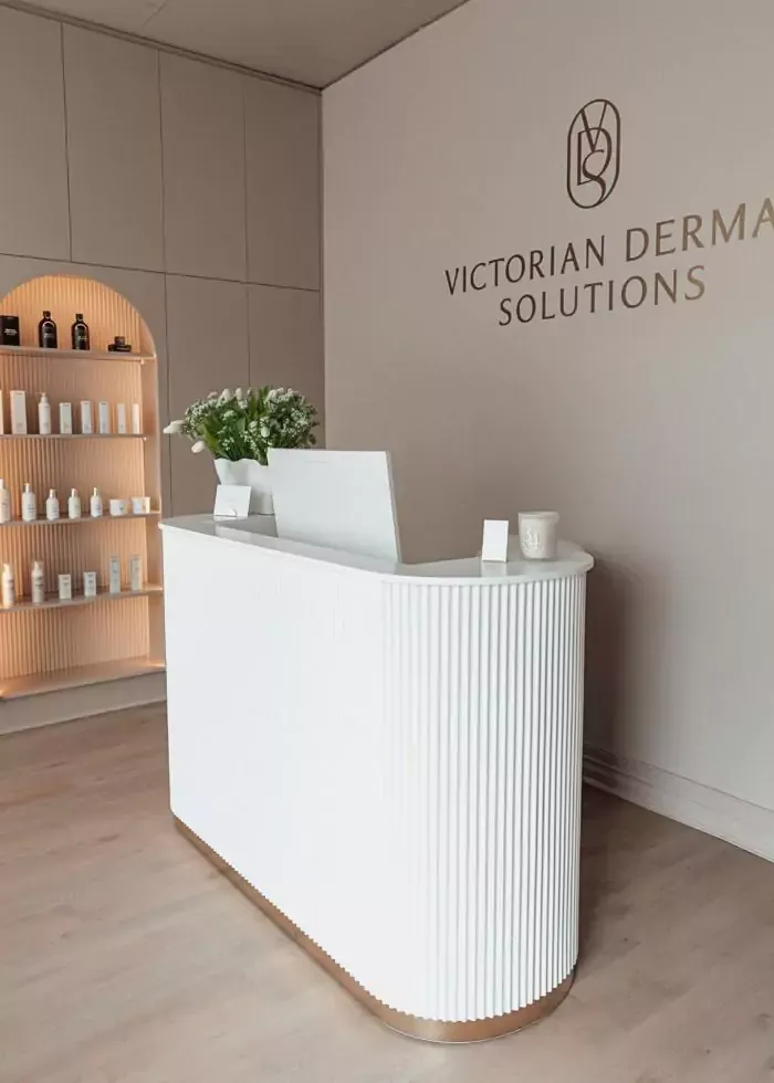 Reception desk in modern salon with product display shelves